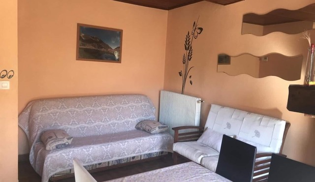 2-bedroom house with garage and garden.