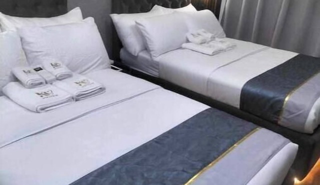 2 Double Beds with Balcony @ KC Suites Makati