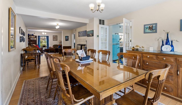 2 units with 6 bedrooms, 6 bathrooms, a kitchen and large dining area.
