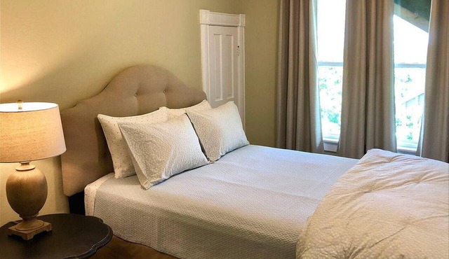 3 bedrooms include a king and two queen size beds, 2 bathrooms, and kitchenette.