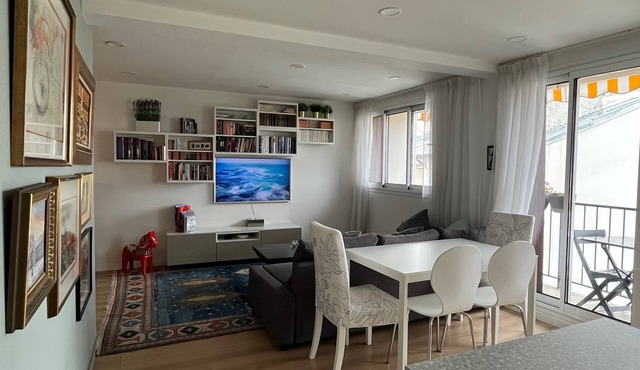A beautiful, modern Parisian apartment, bathed in light, spacious, and airy.