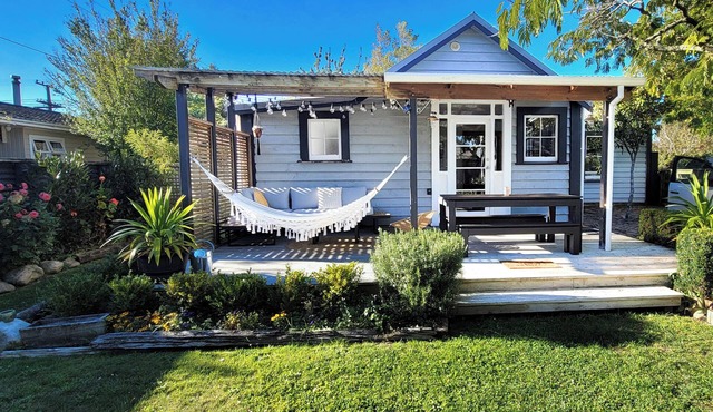 A charming 4-bedroom home! Just steps away from cozy cafes and local shops.