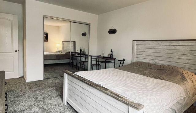 A cozy room with private bathroom and mini kitchen
