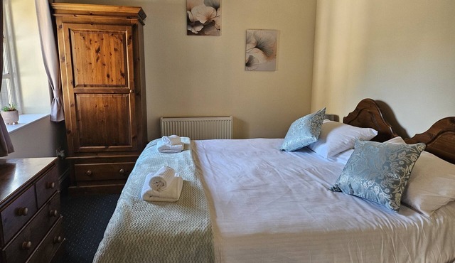a cozy, spacious,accessible room at historic pub