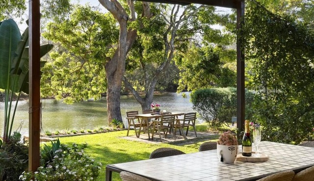 A delightful riverside house -comfortable and stylish - in Urunga