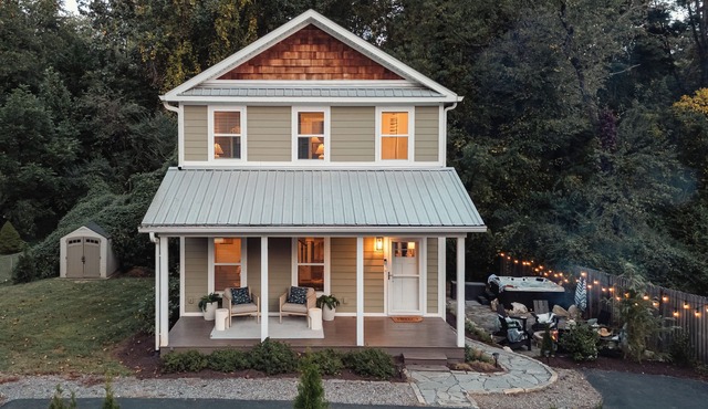 A designer forest retreat near Asheville—hot tub under the trees, fire pit nights, artisan coffee bar mornings, and luxe comfort in the Land of the Sky.