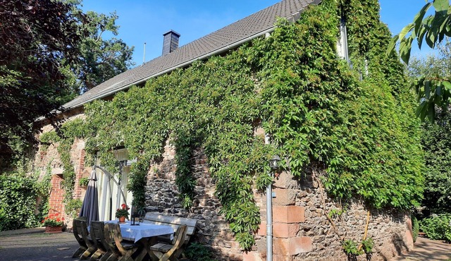 A house with a heart by the stream of peace