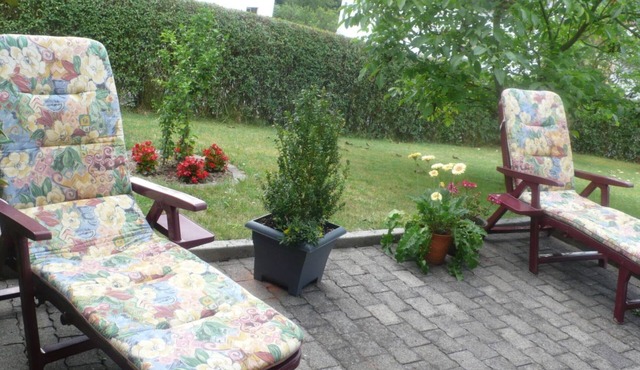 A lawn and a terrace invite you to linger and relax.