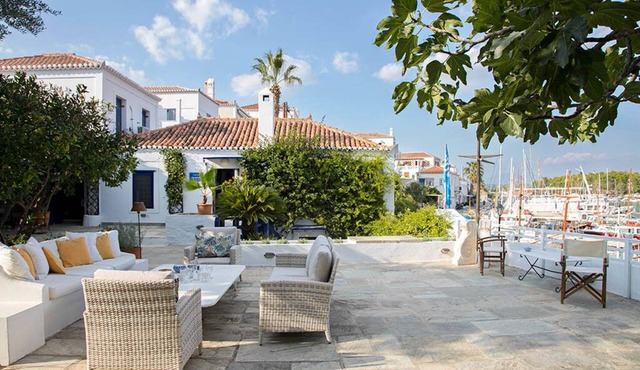 A lovingly maintained four bedroom waterfront house with a unique veranda