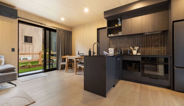 A modern 2-bedroom retreat in the popular Five Mile Villas.