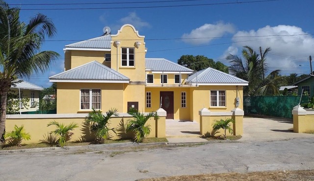 A modern and spacious house, steps to the beach with a private pool!