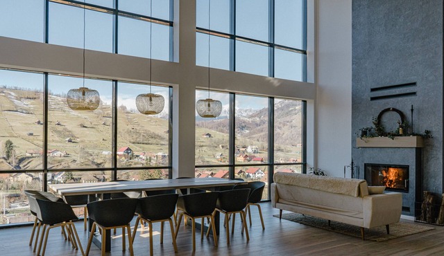 A modern chalet located on a hill with an extraordinary view