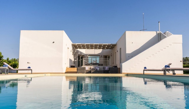 A modern villa set between Sava and Campomarino in a peaceful private setting.