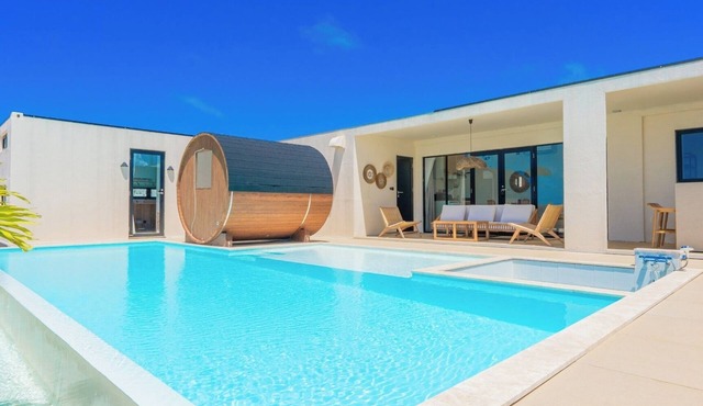 A private villa with a pool jacuzzi and sauna overlooking the ocean from a high vantage point/Miyakojima Okinawa
