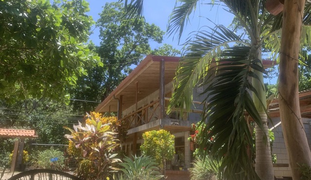 A rustic lodge surrounded by gardens, in a jungle setting - double Room 1