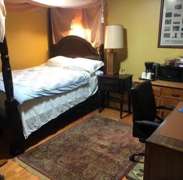 A secluded bedroom with a private full bathroom