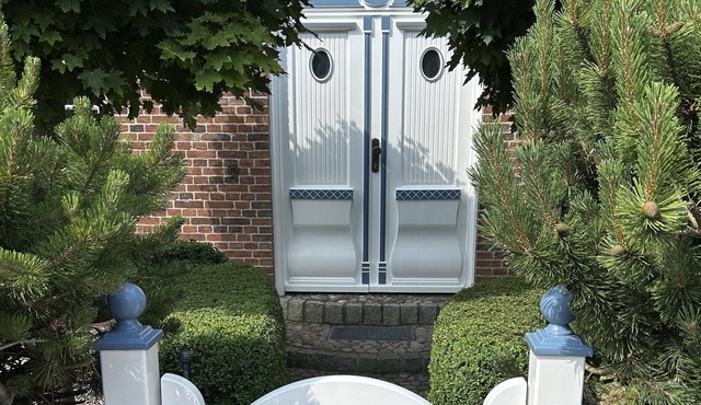 A thatched semi-detached house with parking space for up to 2 cars.