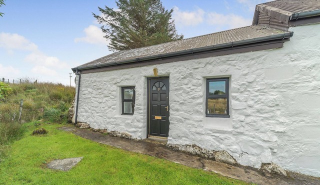 A tiny, traditional cottage tucked away on the Ross of Mull, close to the sea.