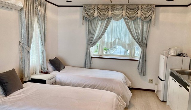 A triple room with a spectacular oceanfront view sunset right in front of you and plenty of amenit/Hamada Shimane