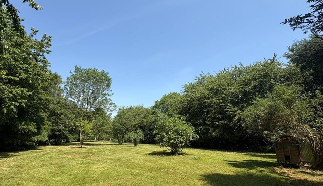 A vast, tree-lined garden; a charming house. Perfect for families or friends.