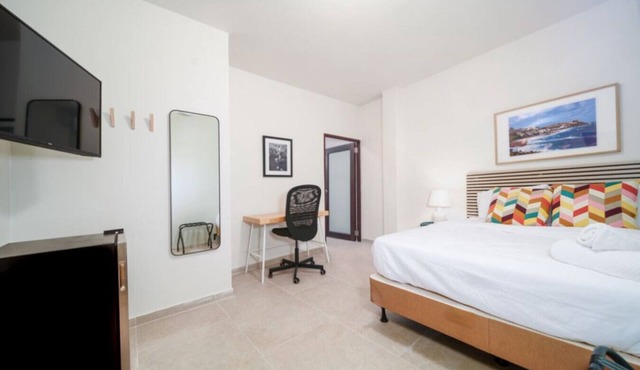 Accessible Suite – Roll-In Shower, Modern Design & Prime San Juan Location