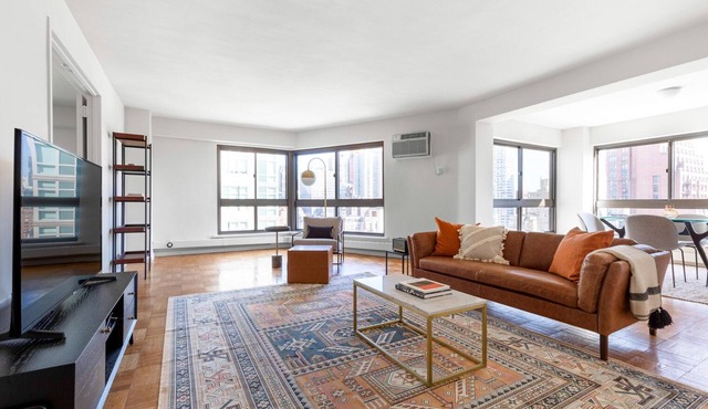 Airy Midtown East 2BR w/Doorman, W/D, nr. Central Park, by Blueground