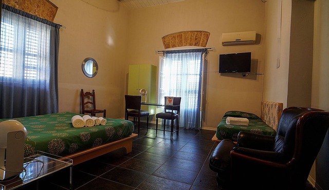 An ancient Sicilian house with a sea-view terrace in the heart of the city.
