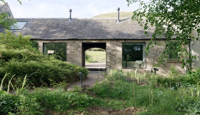 An architect designed rural retreat near Edinburgh with wood-fired sauna.