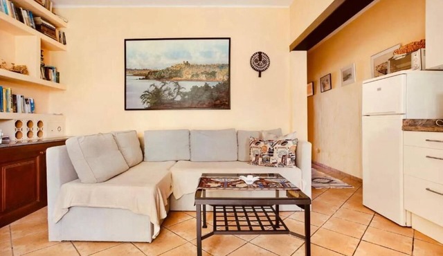 Apartment 1 with panoramic window in the bedroom facing the sea and Risco Famara
