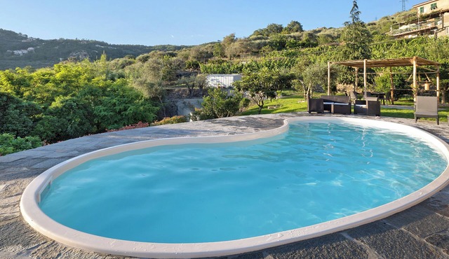 Apartment 'Casa chicken - mare, monti e bikers' with Mountain View, Shared Pool, Garden & Wi-Fi