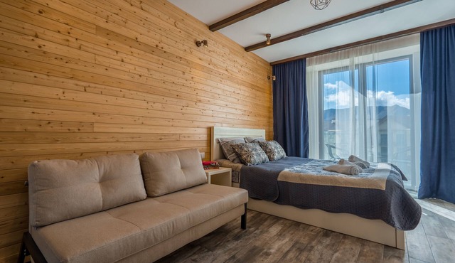 Apartment decorated with a lots of wood, with breathtaking view on mountain