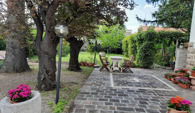 Apartment in villa with large garden, surrounded by greenery and tranquility