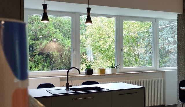 Apartment with kitchen-living room, 3 bedrooms, 2 bathrooms, laundry.