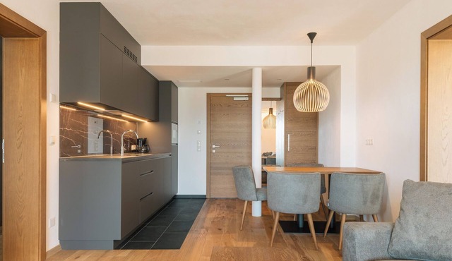 Apartment with large south-facing terrace, incl. garage parking space
