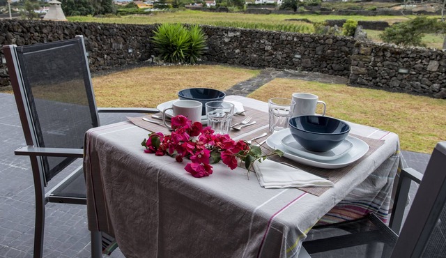 Apartment with private garden and large view of the sea and mountains.