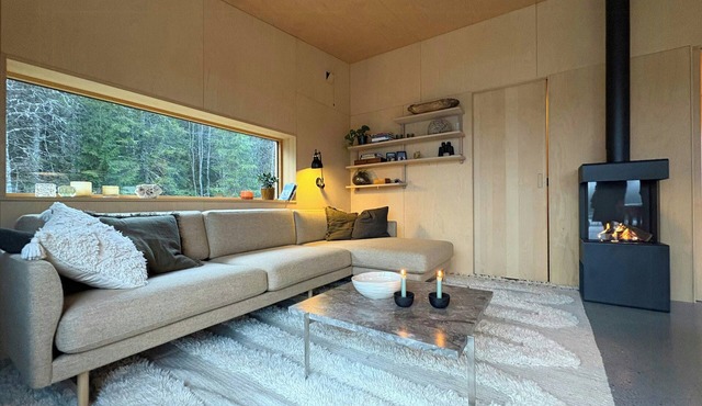 Architect-designed cabin by lake with sauna