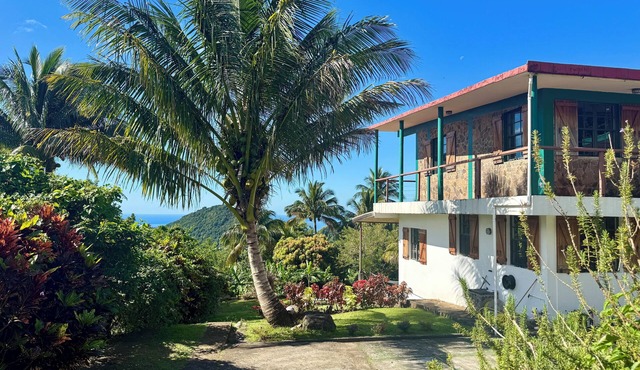 Architect-designed villa with colonial-style veranda. Spa, volcano & sea views .