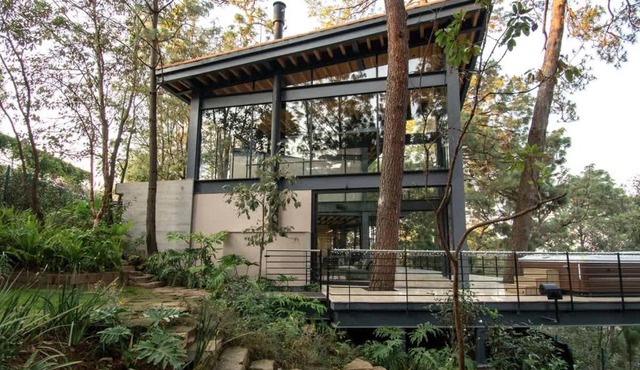 Architectural glass masterpiece villa in Avandaro Forest
