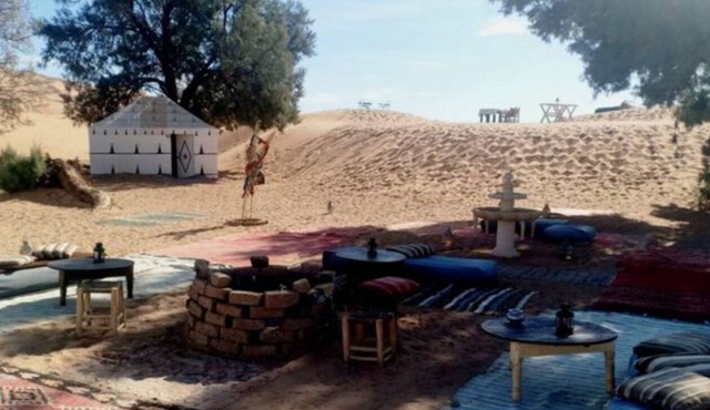 Authentic berber tents surrounded by raw nature in Sahara