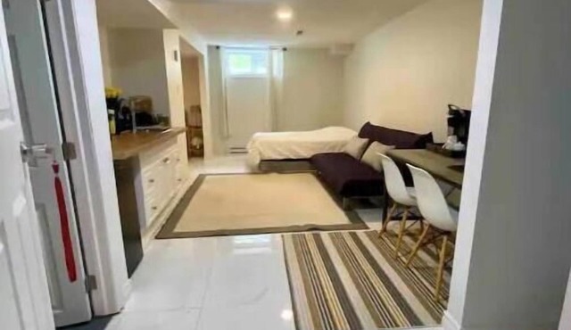Basement studio with an attached private bathroom and parking.