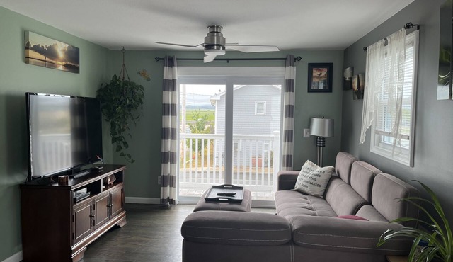 Beach Bum Bungalow offers stunning sunset marsh views just 400 ft to the beach.