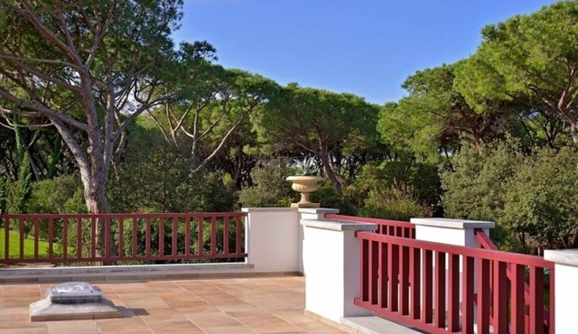 Beach front Casa Rossa, a modern seaside villa, surrounded by a beautiful garden with lawn and r.
