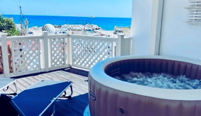 Beach front Villa with hot tub, just steps from the sea