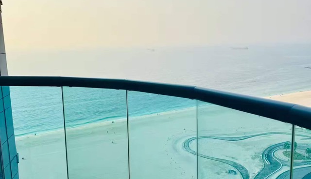 Beachfront 2BR Apartment with Stunning Sea View