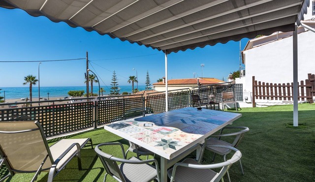Beachfront Apartment with Air Conditioning, Stunning Views, Terrace, and Wi-Fi