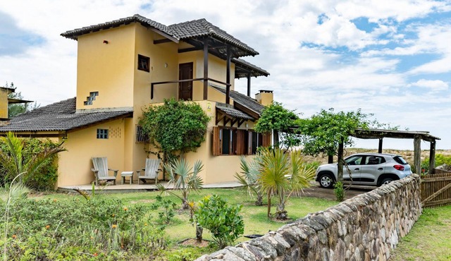 Beachfront house with spectacular views and a large garden.