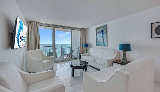 Beachfront condo with balcony & resort pools