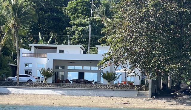 Beachfront. Direct access to safe sandy beach.