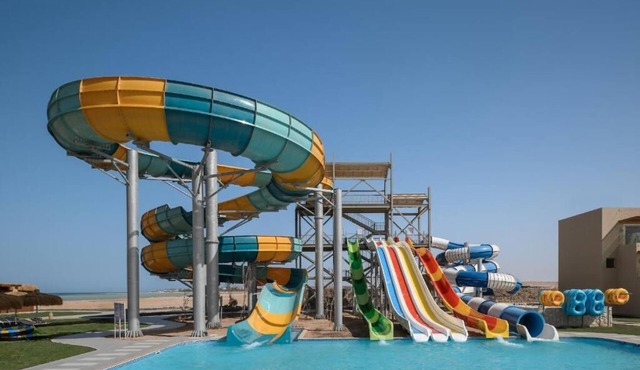 Beachfront Resort with Pools, Kids’ Aqua Park, Spa, Dining & Water Sports