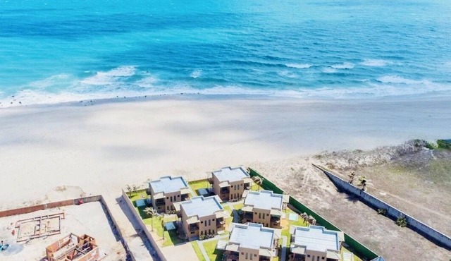 Beachfront fully-equipped 2-bedroom house near Beach Park with AC, WiFi.